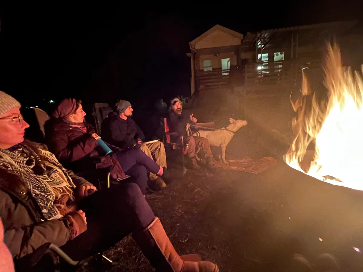 People gathered around a fire pit