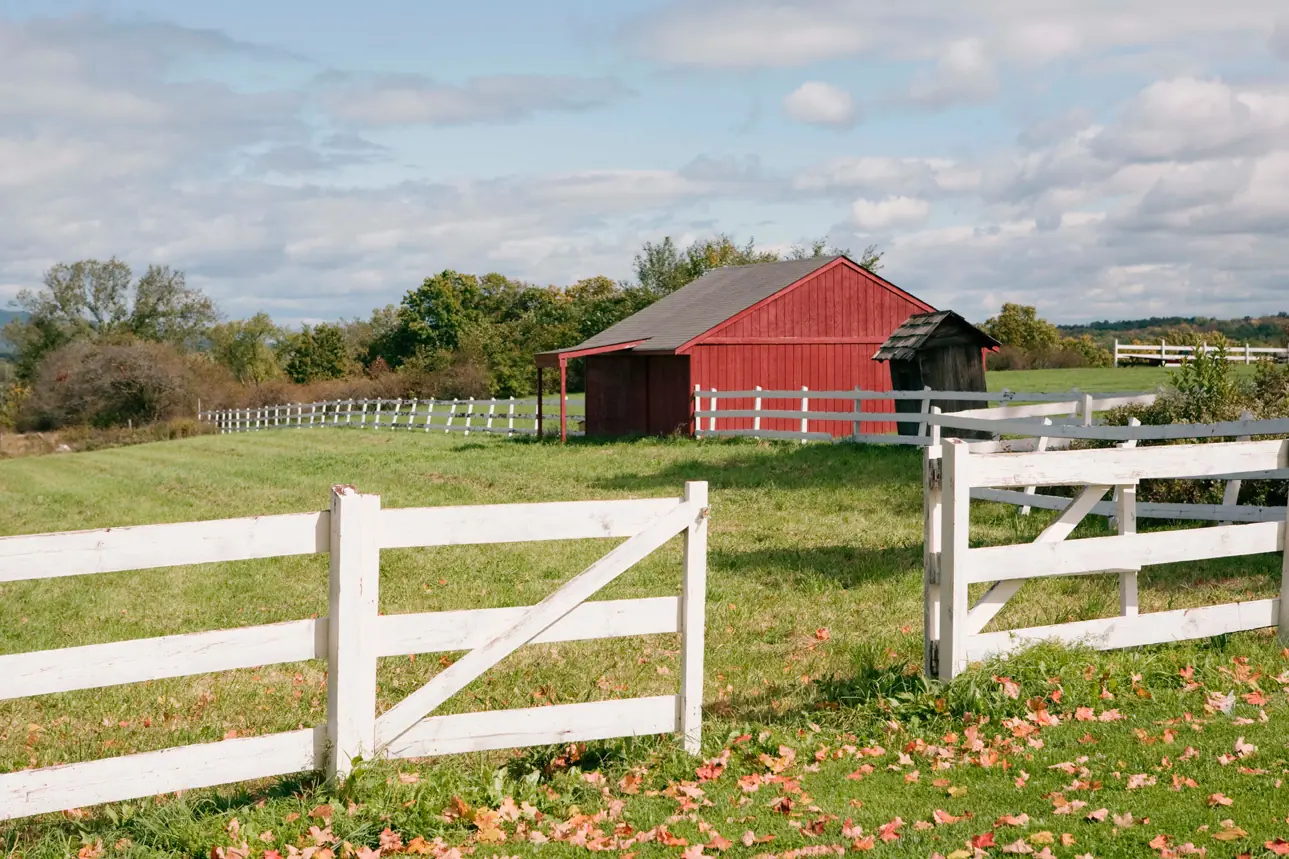 Red barn and fence in a rural landscape
