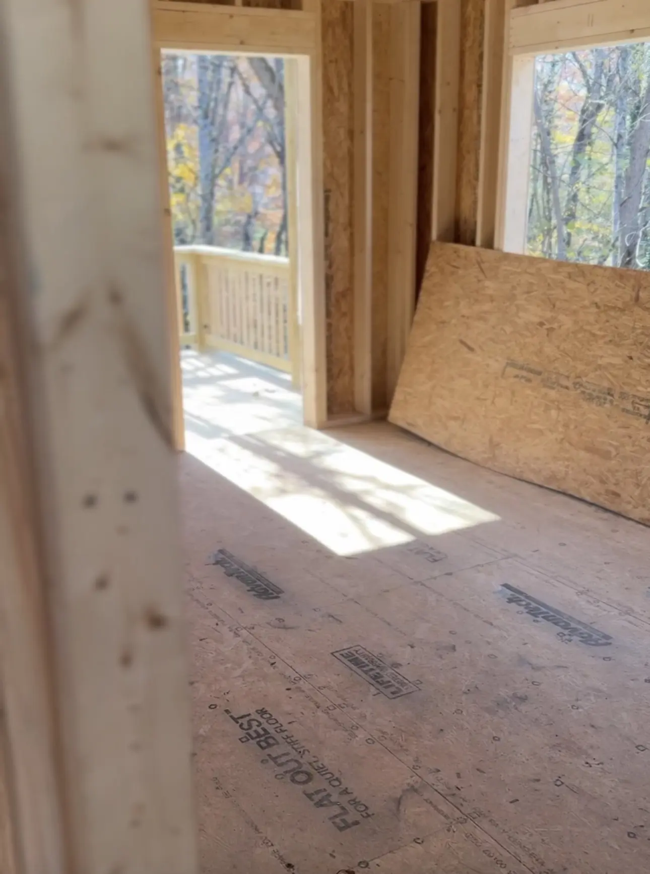 Framed interior opening onto a new porch