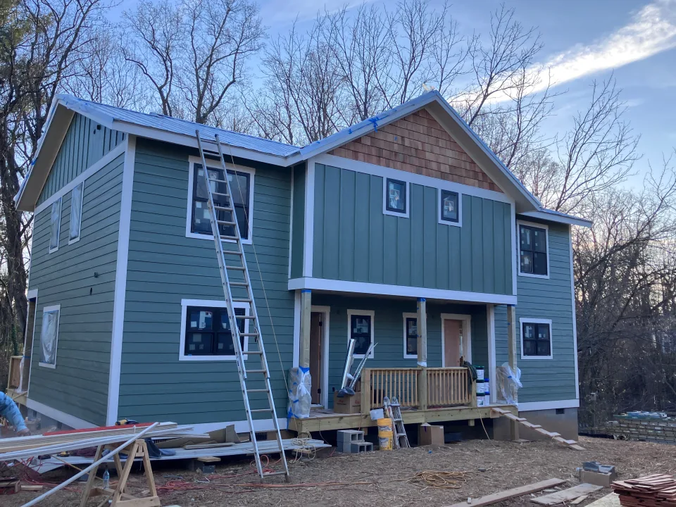 Green duplex receiving exterior finishing work