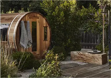Barrel sauna beside an outdoor deck