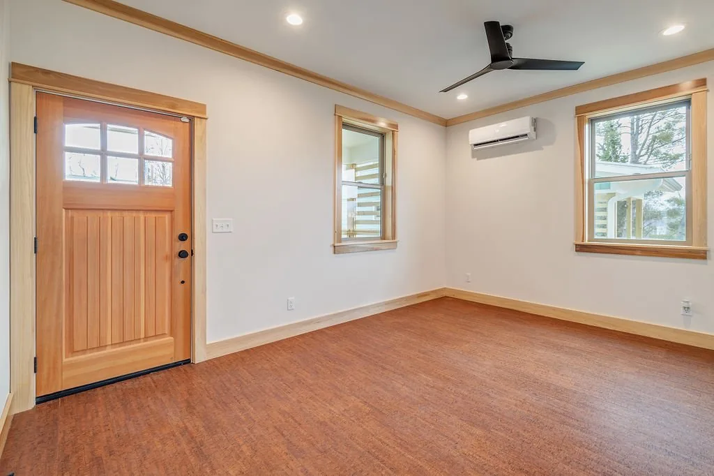 Bright front room with wood trim and a private entrance