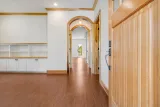 Front entry opens to the family room: cork floors and arched passageways