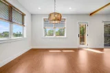 Dining area with mangowood light fixture and deck door
