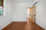 Office with mini-split and glass door to the family room