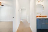 Upstairs hall to the hall bath and laundry