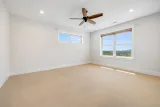 Primary bedroom: wool carpet and mountain views