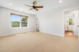 Primary bedroom toward the ensuite and laundry room