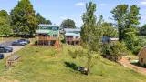 Community life below the deck: fire pit, compost area, and gardens at Terra Futura