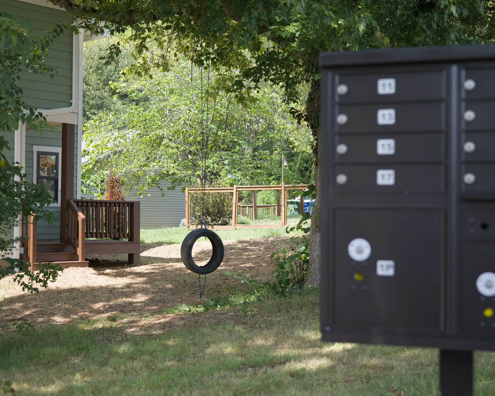 A tire swing between Terra Futura homes and the community mailboxes